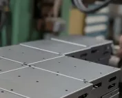 Precision stamped electronic housing by Fox Valley Stamping, showcasing high-quality metal fabrication for custom electronic components.